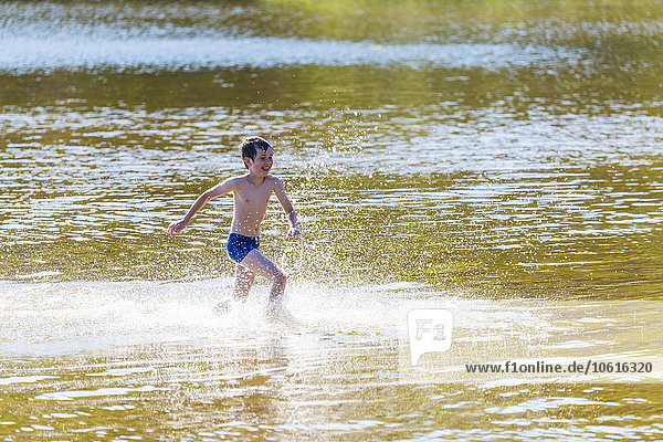 Boy running in water