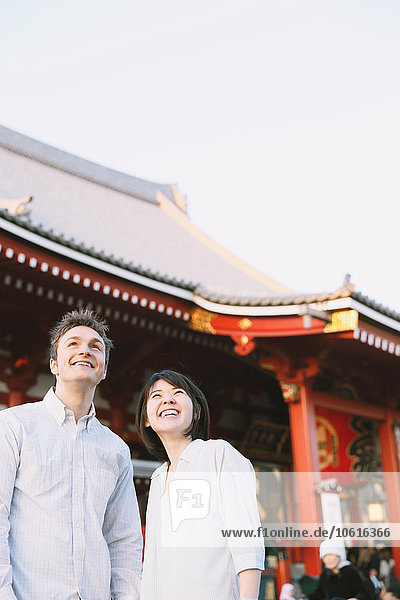 Young multi-ethnic couple enjoying tourism in Tokyo