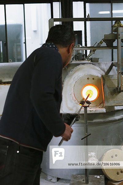 Japanese glass artisan working in the studio