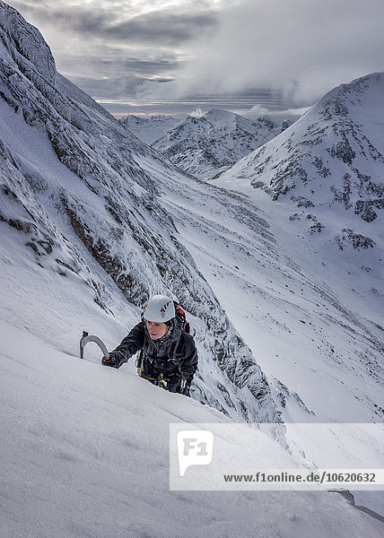 UK  Scotland  Glencoe  West Face Aonach Mor  woman ice climbing