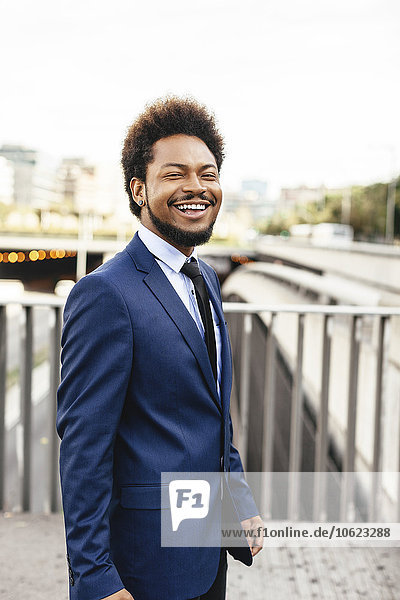 Portrait of smiling businessman wearing blue suit