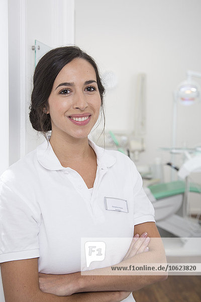 Portrait of smiling dentist at surgery