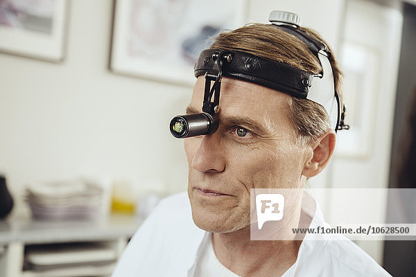 Doctor wearing surgical headlight