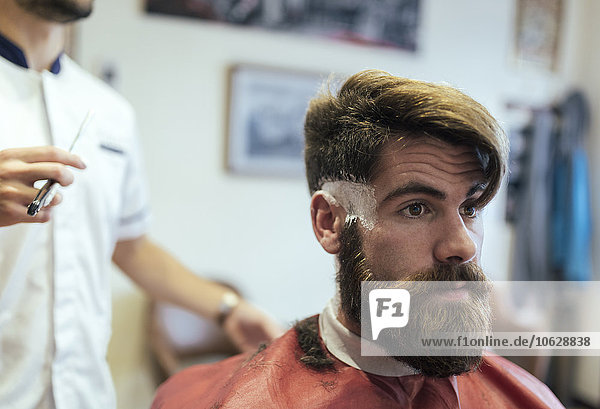 Customer with full beard in a barber shop