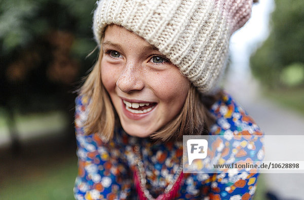 Portrait of smiling girl wearing woollen cap