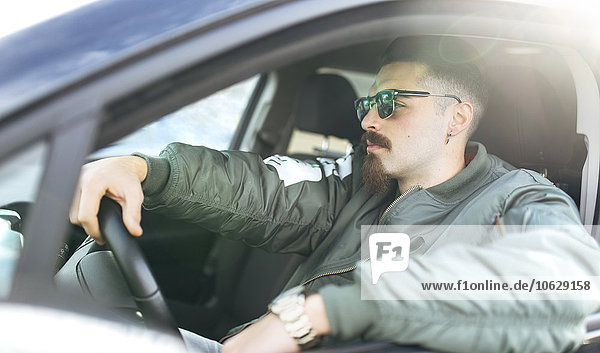 Young man driving a car