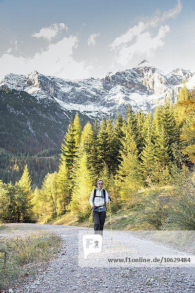 Austria  Salzburg State  Maria Alm  woman hiking in alpine landscape