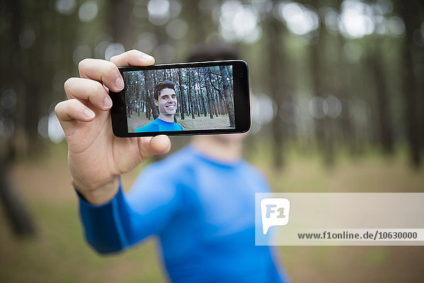 Selfie of a runner on the display of a smartphone