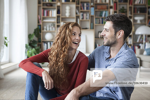 Happy couple relaxing at home