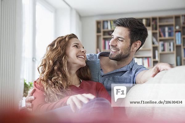 Relaxed couple at home on couch