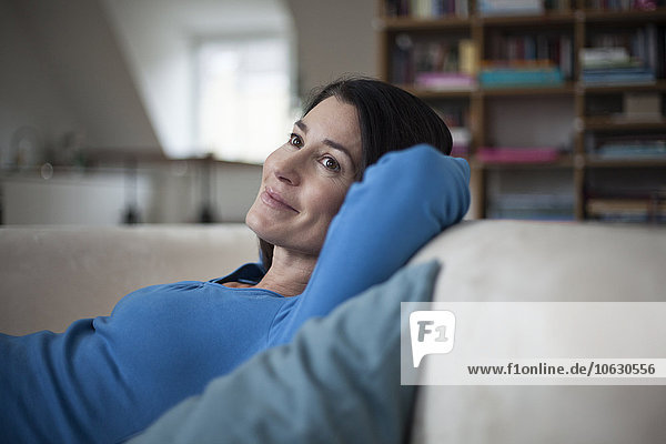Smiling relaxed woman at home