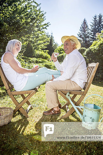 Happy elderly couple in garden
