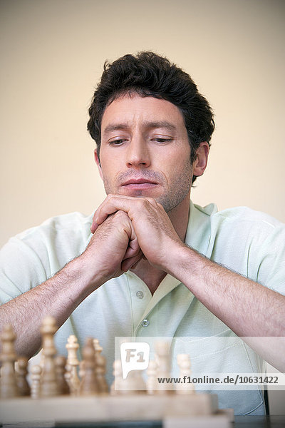 Portrait of man playing chess