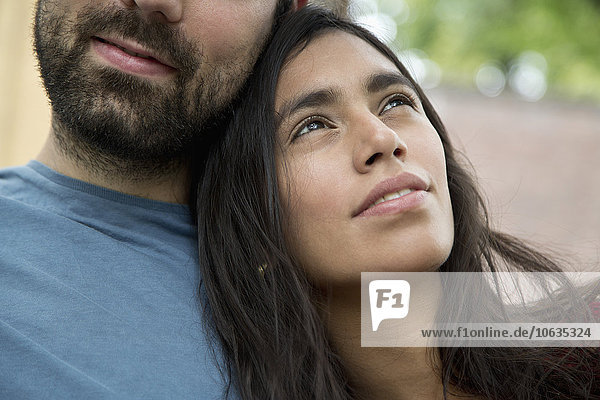 Woman leaning on man's shoulder  close-up