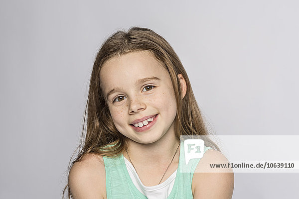 Portrait of happy girl against white background