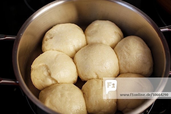 Steamed yeast dumplings in a pot  yeast dough  Southern German specialty