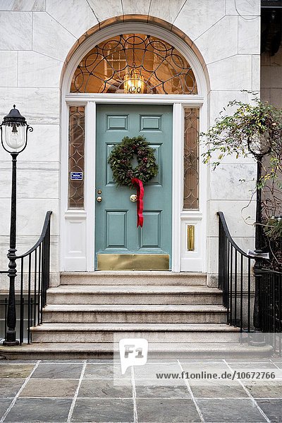 Christmas Wreath Decorating the Door of an Upper East Side  New York City  Townhouse.