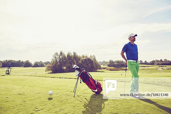 Golfer beside golf bag on course  Korschenbroich  Dusseldorf  Germany