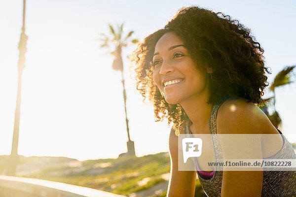 Portrait of mid adult woman  smiling  outdoors