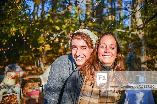 Portrait of young man and mother in woods