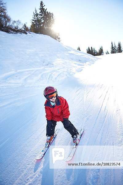 Young skier going downhill