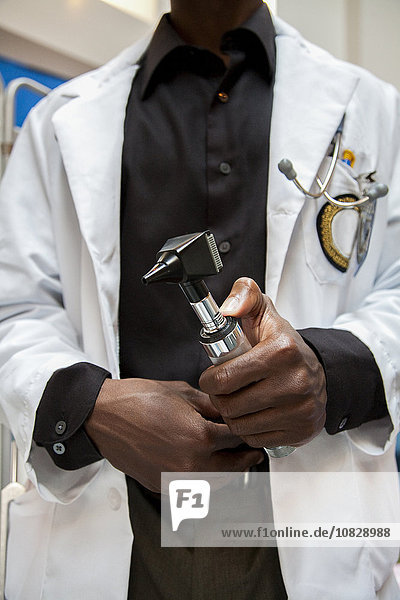 Close up of doctor holding medical tool in hospital