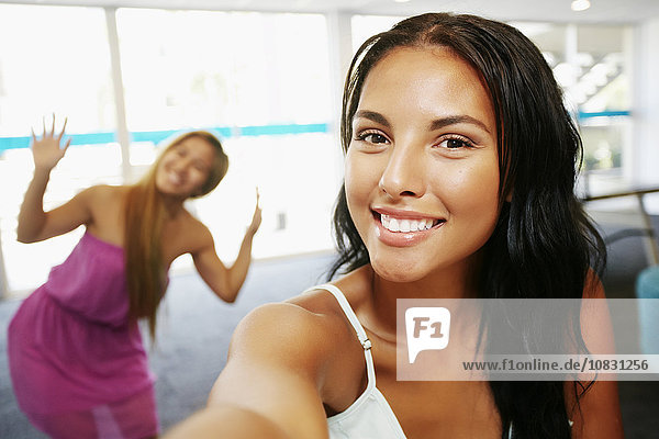 Smiling women posing indoors