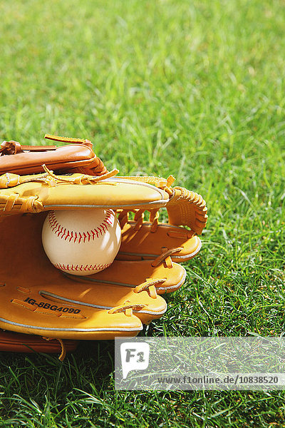Baseball equipment on grass
