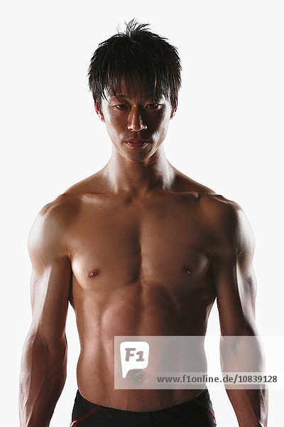 Japanese male athlete showing off muscles