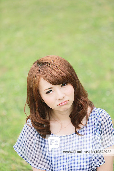 Young attractive Japanese woman in a city park