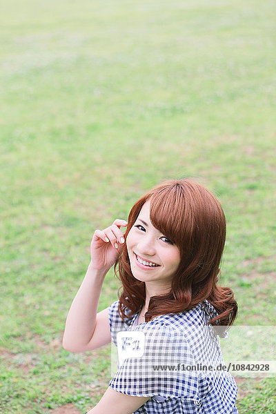 Young attractive Japanese woman in a city park