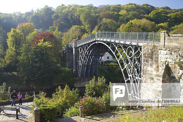 Worlds first iron bridge spans the banks of the River Severn in autumn sunshine  Ironbridge  UNESCO World Heritage Site  Shropshire  England  United Kingdom  Europe