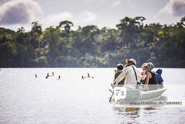 Canoe boat trip in Amazon Jungle of Peru  by Sandoval Lake in Tambopata National Reserve  Peru  South America