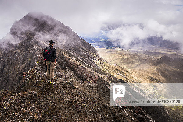 Climber on Ruminahui Volcano summit  Cotopaxi National Park  Avenue of Volcanoes  Ecuador  South America