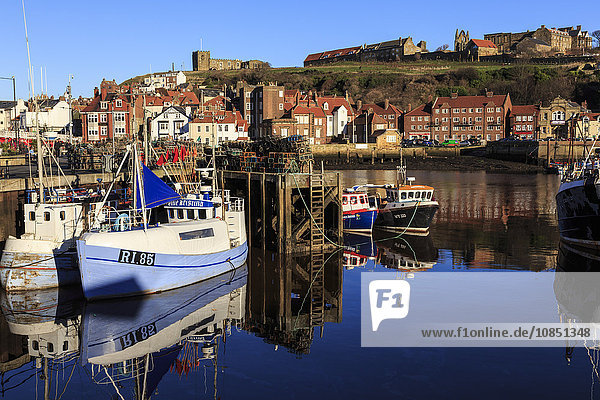 St. Mary's Church and reflections at Endeavour Wharf with lobster pots and boats  Upper Harbour  Whitby  North Yorkshire  England  United Kingdom  Europe