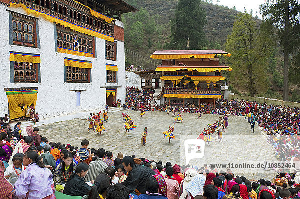 Crowds watching the dancers at the Paro festival  Paro  Bhutan  Asia