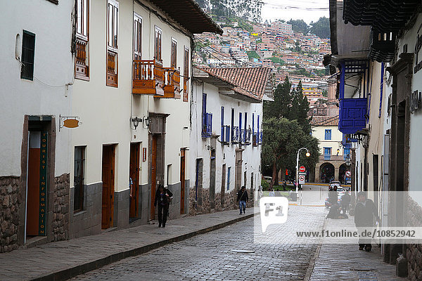 Side street in centre of Cusco City with outskirts of city on hill beyond  Cuzco  Peru  South America