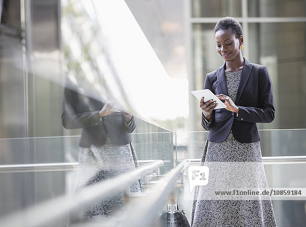 Corporate businesswoman using digital tablet