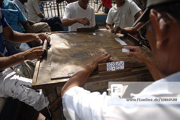 Group of people playing domino  Santiago de Cuba  Cuba  America