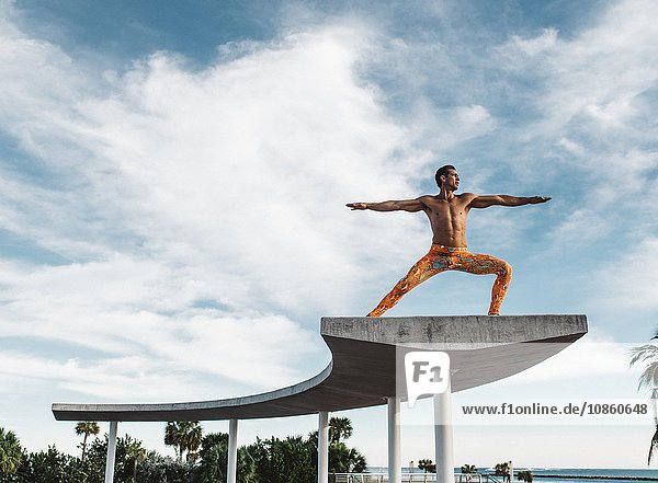 Mature man balancing on structure South Pointe Park South Beach Miami Florida USA