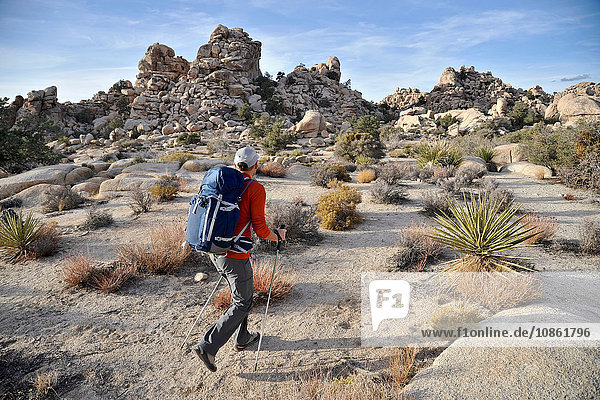 Hiker exploring Mojave Desert Joshua Tree National Park California