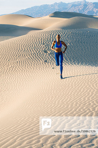 Runner sprinting in desert  Death Valley  California  USA