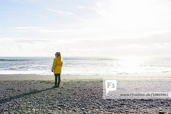 Woman enjoying beach Reynisfjara Iceland