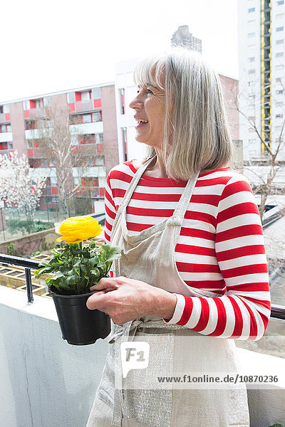 Woman gardening on balcony