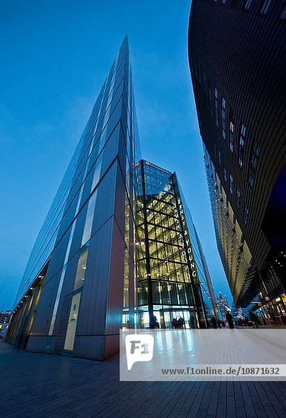 Oblique angled modern building at night London UK