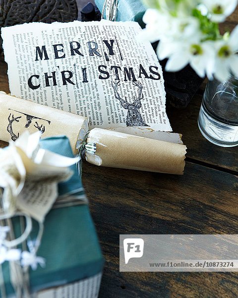 Close up of handmade christmas gift wrapping and christmas cracker