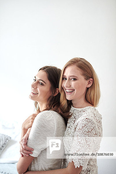 Side view portrait of two beautiful young women
