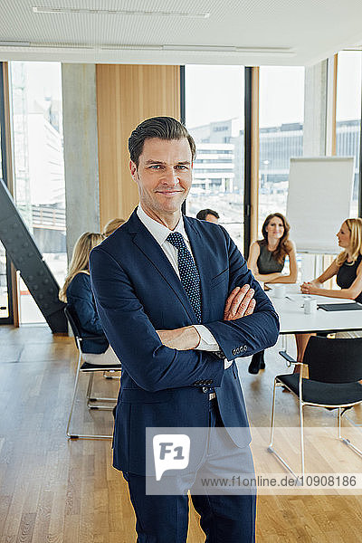 Portrait of confident businessman in a meeting