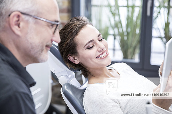 Young woman consulting dentist
