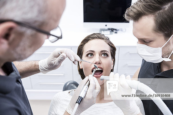 Young woman at the dentist receiving treatment